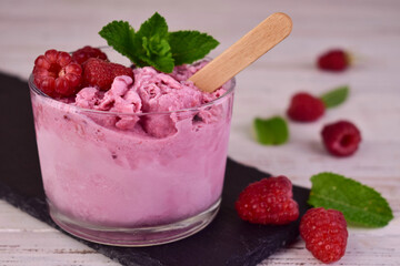 A glass of homemade raspberry ice cream. Close-up.
