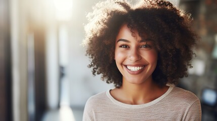 Smiling woman's portrait with afro hair, exuding happiness in a close-up shot - obrazy, fototapety, plakaty