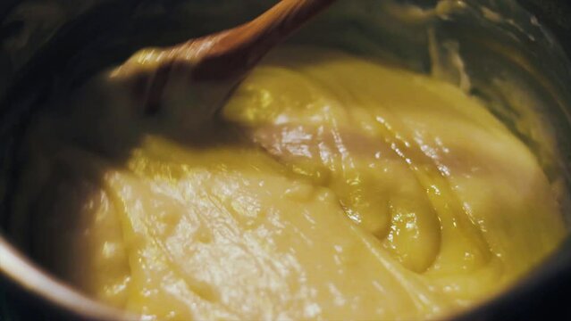 the prepared pudding is put on the jelly cake