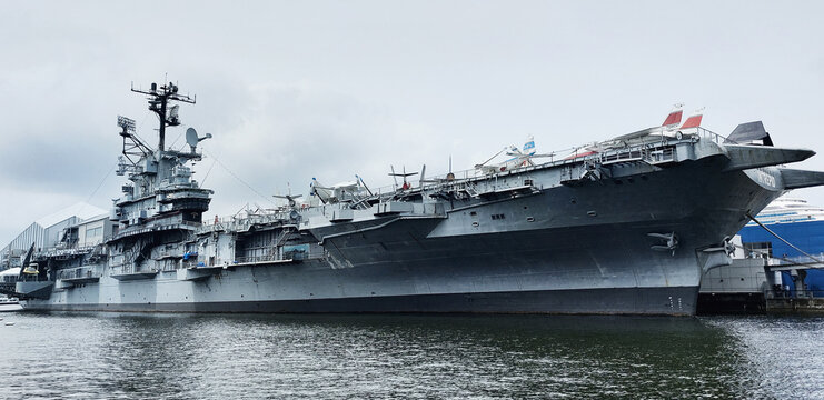 New York, United States - August 5, 2023: Aircraft Carrier Intrepid berthed on the Hudson river as the centerpiece of the Intrepid Sea, Air & Space Museum