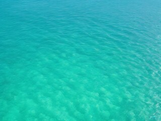 Fototapeta na wymiar Beautiful tropical turquoise clear sea water surface