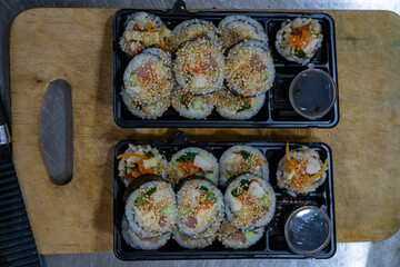 the exquisite art of Japanese cuisine with our expertly crafted sushi, beautifully arranged in a convenient box.
