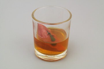 Effect of alcohol on the liver concept. Liver in whiskey glass.	