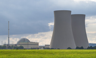 Green landscape and nuclear power plant .