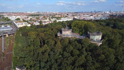 Railroad Station Gesundbrunnen. Wonderful aerial top view flight 
Flak tower Humboldthain Bunker World War 2, Berlin mitte summer 2023. panorama overview drone
4k cinematic
