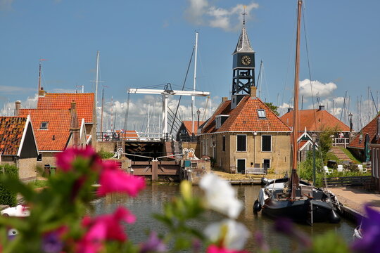 The historical town of Hindeloopen, Friesland, Netherlands, with historical houses, canals, a mooring boat and a drawbridge