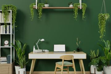 A modern stylish green home office workspace with a laptop on a table against the green wall