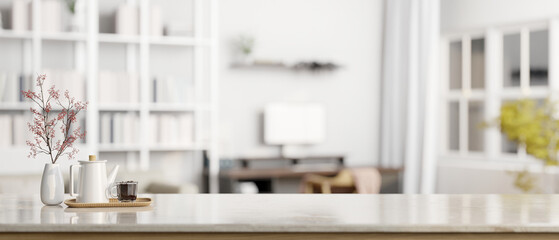 Copy space on a tabletop with blurred modern white home office in the background.