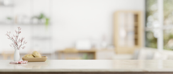 A tabletop with copy space on a blurred modern white home office in the background.