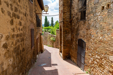 Old alley on a village in Tuscany
