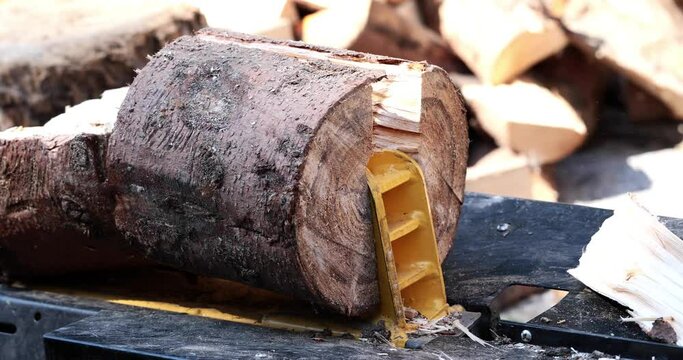 electric wood splitter cuts blocks in half