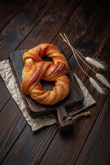 Polish pretzel puff pastry on brown boards. Bakery products. Fresh bakery.