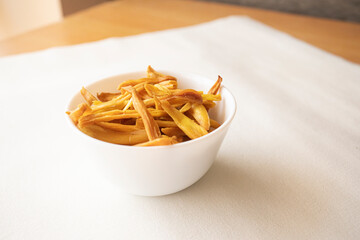 A bowl of crispy Jack fruit chips an Indian snack most famous in south India 