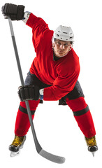 Concentrated man, hockey player in uniform standing with stick isolated on transparent background
