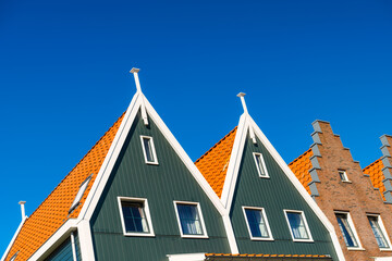 Tile roof and blue sky background. Old building. Architecture and construction. Photo for background and wallpaper.