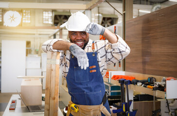 black male carpenter Professional in furniture carpentry room. New design concept in DIY workshop.