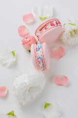 Beautiful Set colorful French macaroons and flowers. Flat lay, top view, spring white background. Concept banner Valentines, Birthday, Woman or Mothers Day gift