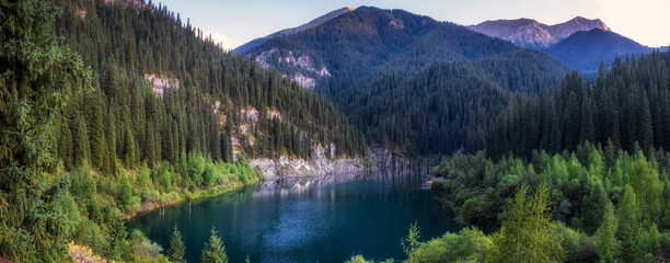 Panorama of the mountain lake Kaindy in the evening. Kazakhstan Almaty region Tien Shan mountain system