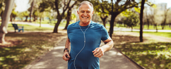 Senior man going for a run and living a healthy lifestyle for longevity - Powered by Adobe