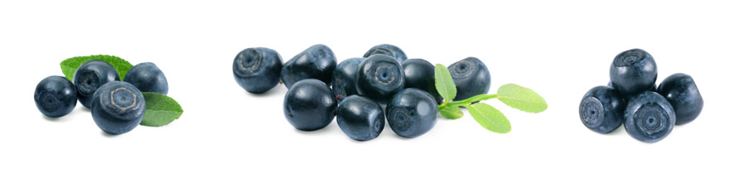 Set with tasty fresh bilberries and green leaves isolated on white