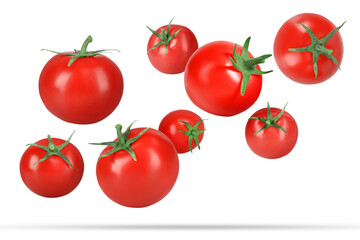Many fresh ripe tomatoes falling on white background