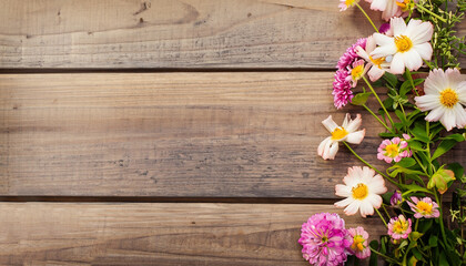 Fototapeta na wymiar Summer Flowers on wood texture background with copyspace