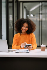 Women are using calculators to calculate office income.