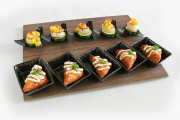 mini bites scallop mango salad and bbq prawn paste bread canapés butler in small plate in white background appetiser Christmas festival party halal food hotel cuisine restaurant menu