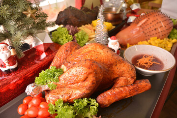 Merry Christmas happy season party buffet eve night with bbq roast whole turkey, honey pork ham,...