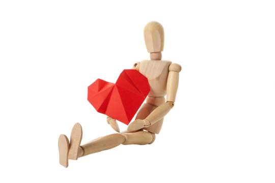 PNG, paper heart in the hands of a wooden doll. Blood donation, isolated on white background