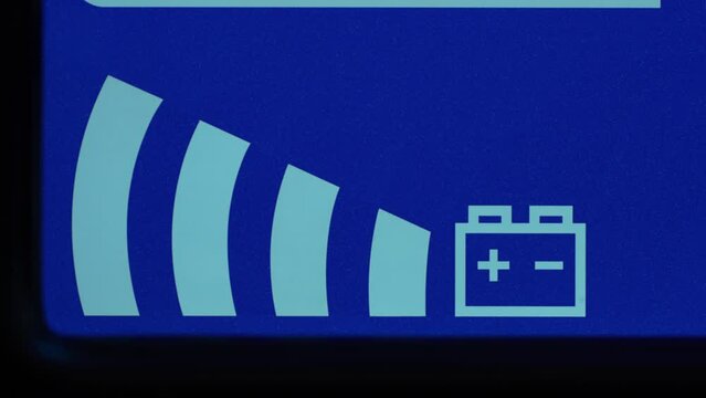 Close up of blue digital display on uninterruptible power supply with automatic voltage stabilizer