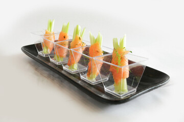 chef raw smoked salmon fish seafood wrapped with vegetable in cocktail cup canapés butler in plate...