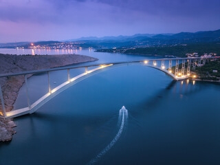 Bridge over the sea at sunset. Aerial view of modern Krk bridge