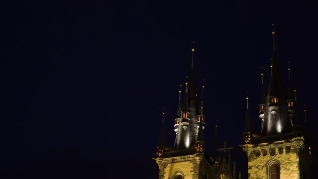 top of a castle tower fortress baroque gothic style architecture similar to Hogwarts school of witchcraft harry potter building in Czech Republic gothic baroque night time dark sky