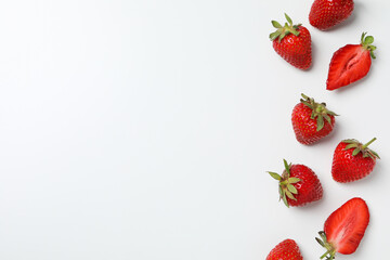 Strawberries on white background, space for text