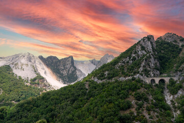 Fototapeta na wymiar Sunset in the Marble Mountains of Carrara in Tuscany, Italy