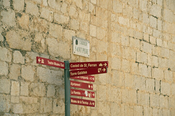 Landscape of signs outside of Theater Museum of Salvador Dali in Figueres Catalonia