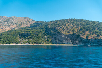Obraz premium Kroreza or Krorez beach seen from the boat on the Albanian riviera near Sarande and its turquoise waters, Albania