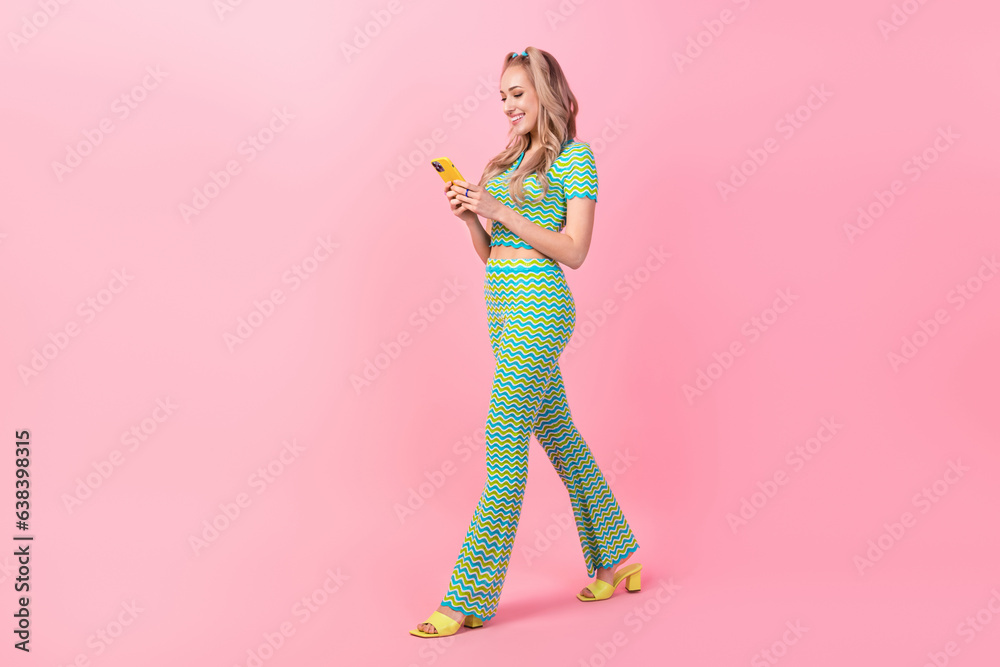 Sticker Full body photo of pretty young girl walking telephone read comment wear trendy green print outfit isolated on pink color background