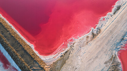 Aerial view of pink salt lake. Salt production plants evaporated brine pond in a salt lake. Salin...