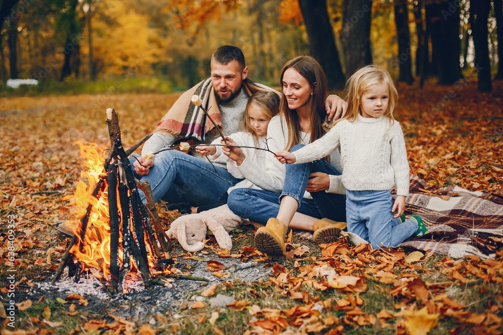 Wall mural Family with cute kids in a autumn park