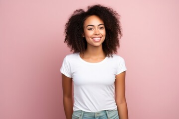 female model wearing white tshirt on pink background for mock up photos