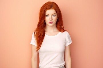 Obraz premium red head wearing white tshirt on plain background for mock up or presentation