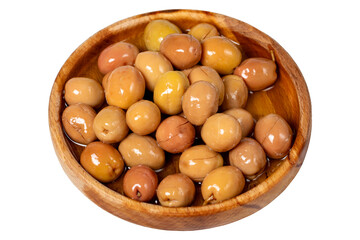 Scratched green olive at wooden bowl. Green olives isolated on white background. Mediterranean food. vegan food. Close up