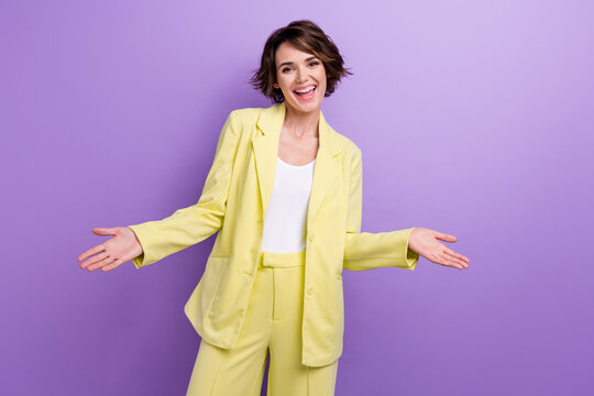 Photo Of Cheerful Boss Young Girl Wear Lime Stylish Suit Shrug Shoulders Friendly Greetings New Worker Isolated On Purple Color Background