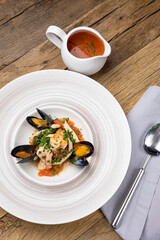 A delicious seafood soup in a restaurant. Close-up