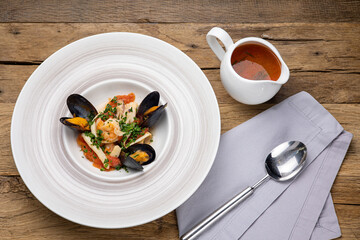 A delicious seafood soup in a restaurant. Close-up