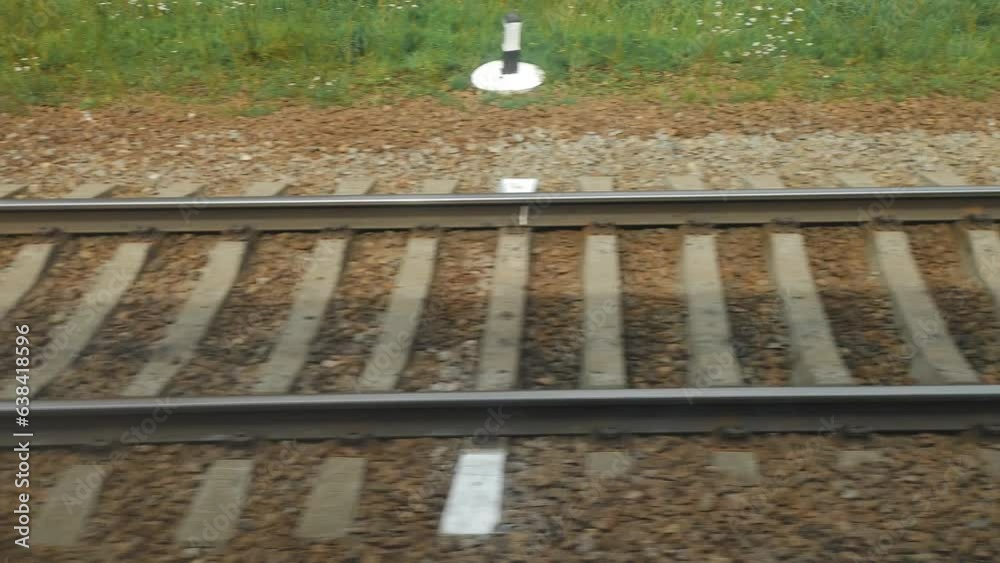 Poster fast-moving railway outside train window.