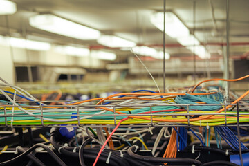 The web of cables in the server room can be confusing to navigate. The web of cables in the server room can be confusing to navigate.