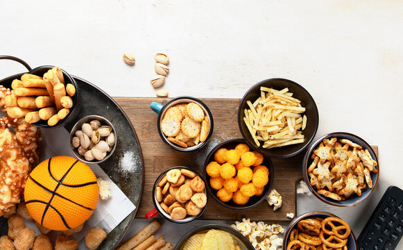 Snacks On White Table With Basketball Ball, Game Night Food.